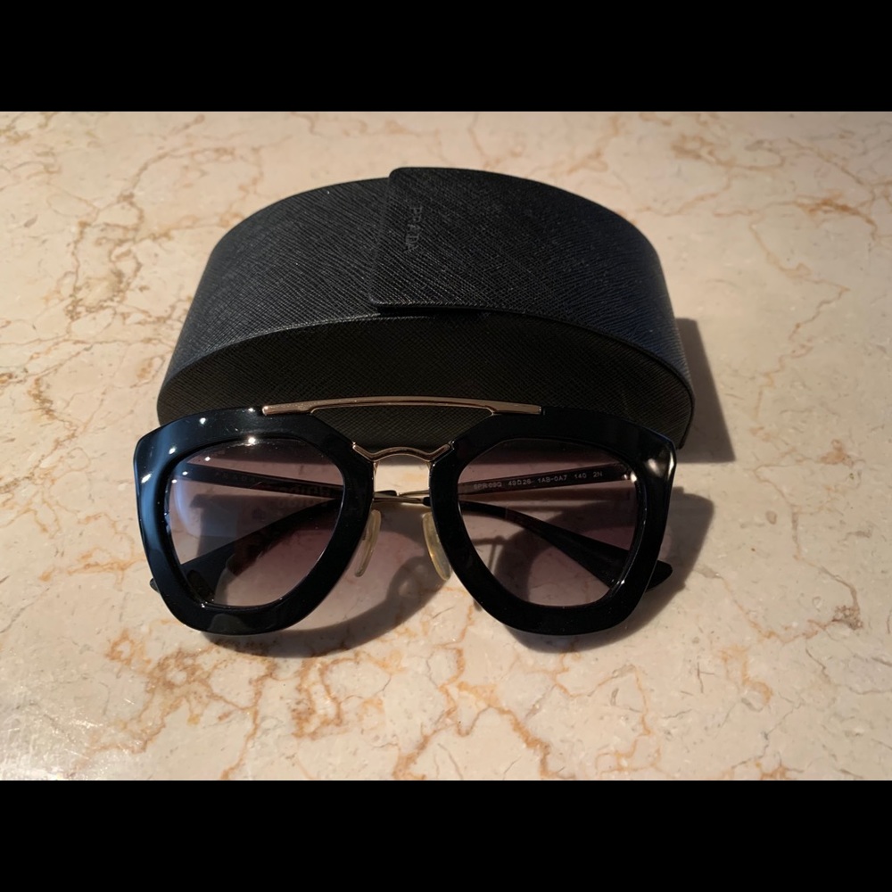 Black Prada sunglasses with gold detail